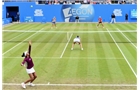 BIRMINGHAM, ENGLAND - JUNE 15:  Raquel Kops-Jones and Abigail Spears (R) of the United States in action during the Doubles Final during Day Seven of the Aegon Classic at Edgbaston Priory Club on June 15, 2014 in Birmingham, England.  (Photo by Tom Dulat/Getty Images)